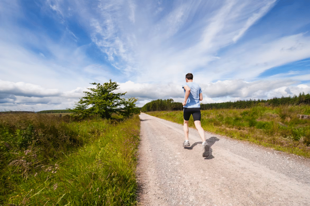 A man runs along a dirt road, following the tips to stay healthy for managing executive dysfunction.