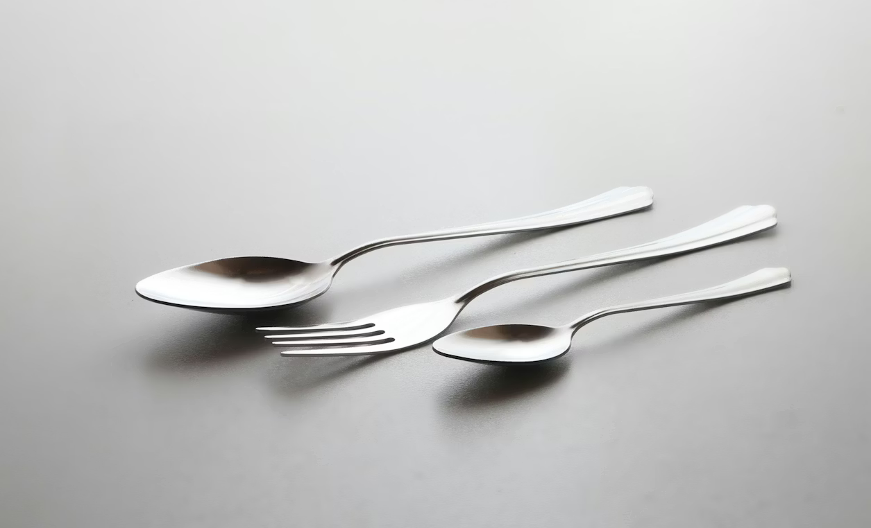 Spoons and a fork on a table are used to represent spoon theory and fork theory.