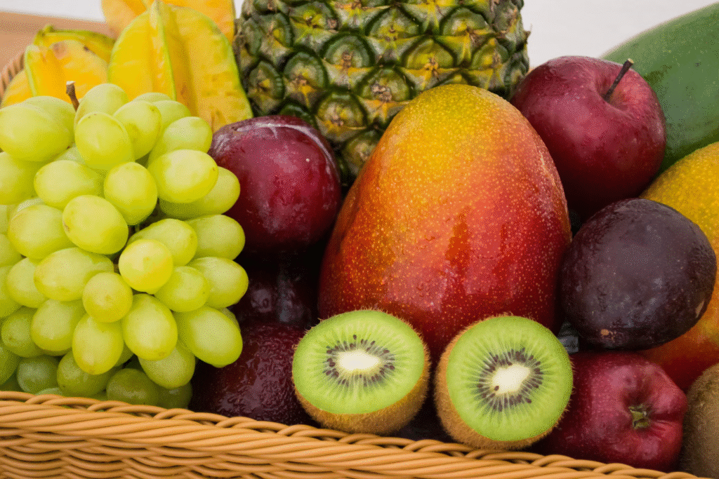A variety of fruits in a basket as an example of easy and healthy snacks.