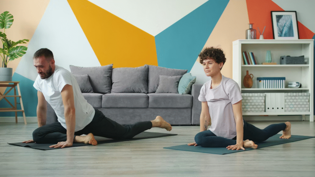 A couple do flexibility exercises together to maintain their fitness and physical health.