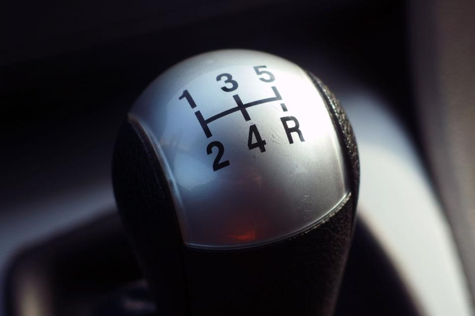 A gearstick as an analogy for switching tasks.