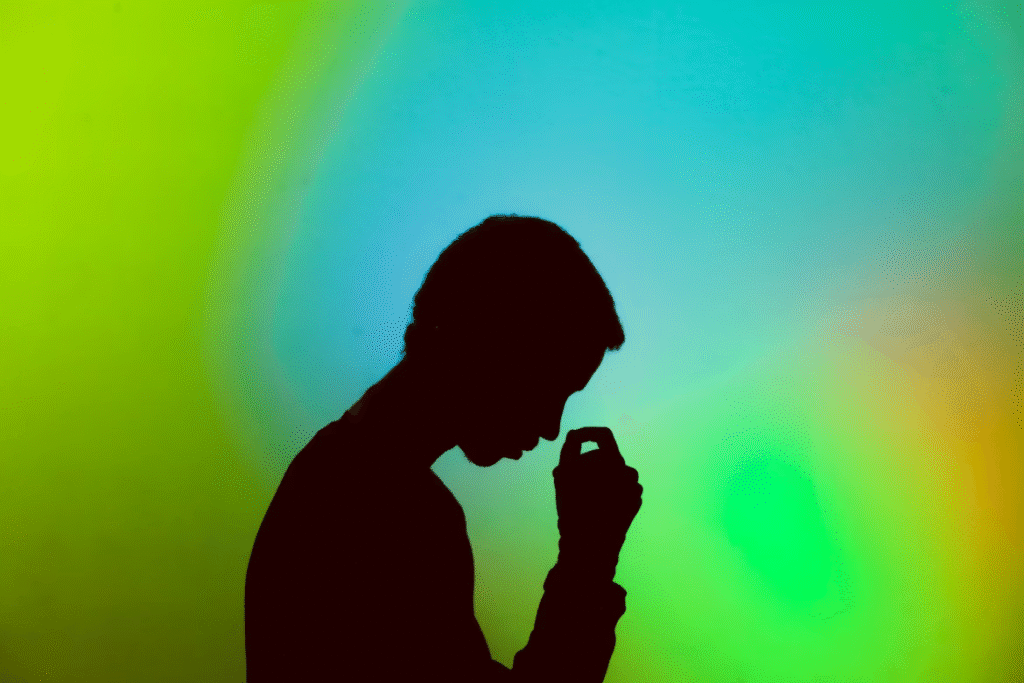A silhouette of a stressed person having mental health difficulty.